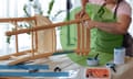 Lead image for Change by degrees on sustainable furniture, showing a woman repairing a wooden chair