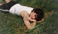 a man lying on grass