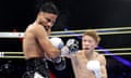Naoya Inoue, right, lands a punch on Ramon Cardenas in the seventh round of their title fight at T-Mobile Arena in Las Vegas.
